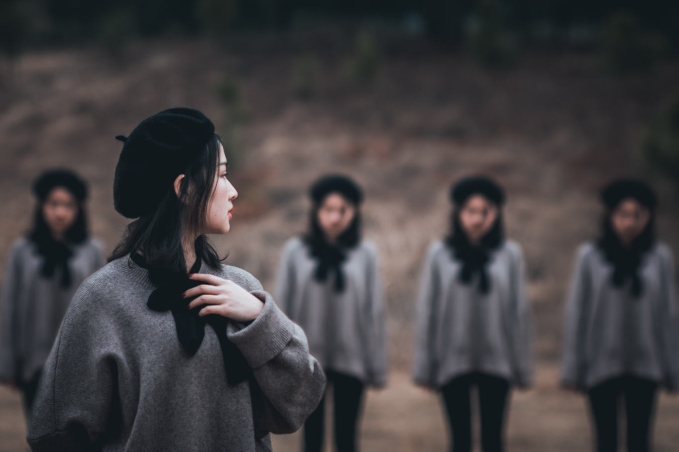 Woman looking over shoulder at group of women